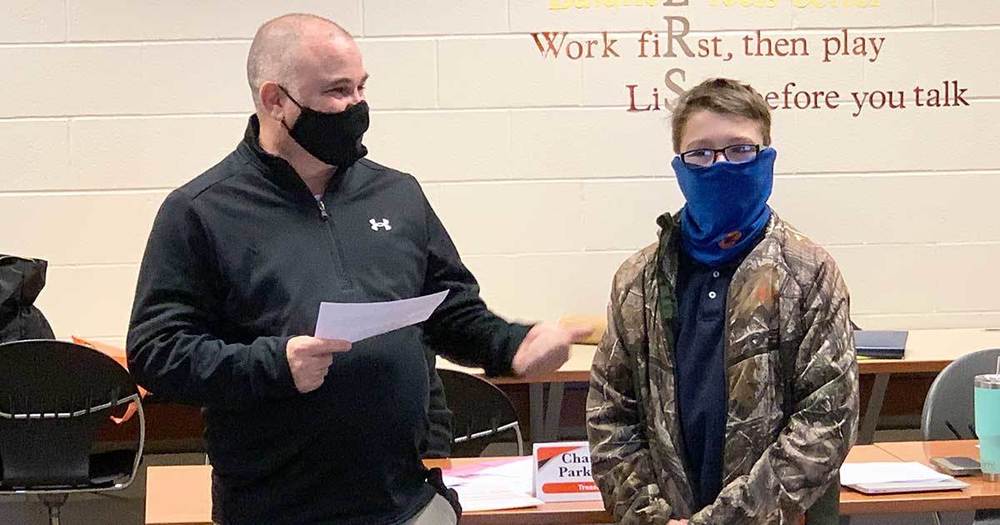 School board member posing with student in meeting