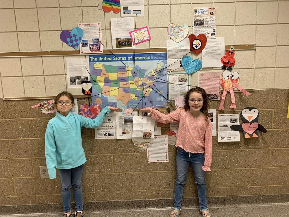 Students standing in front of Valentine display