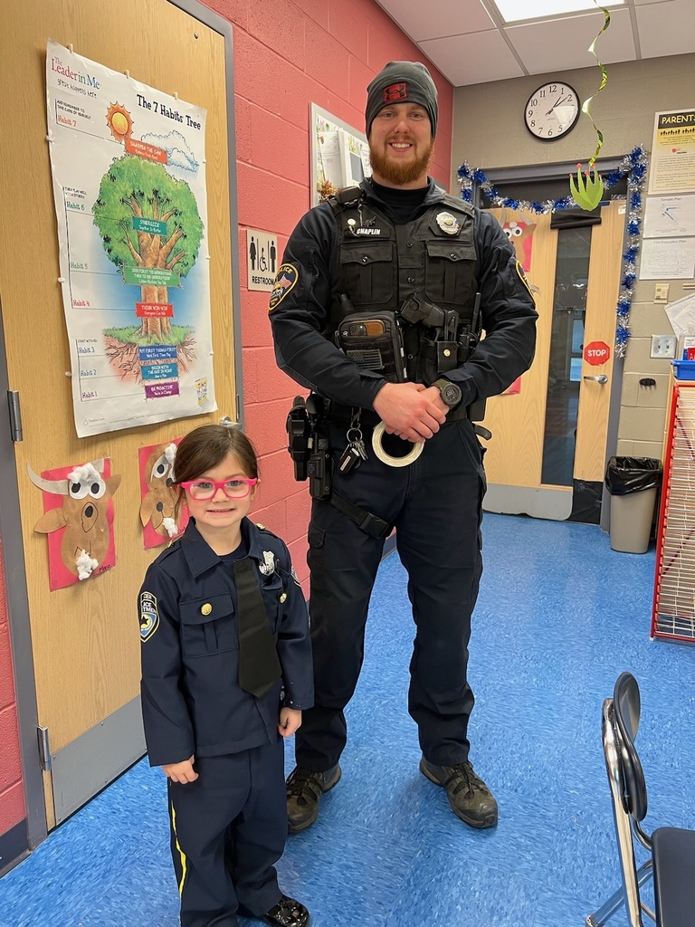 Student dressed as police officer standing with Galion Police Officer