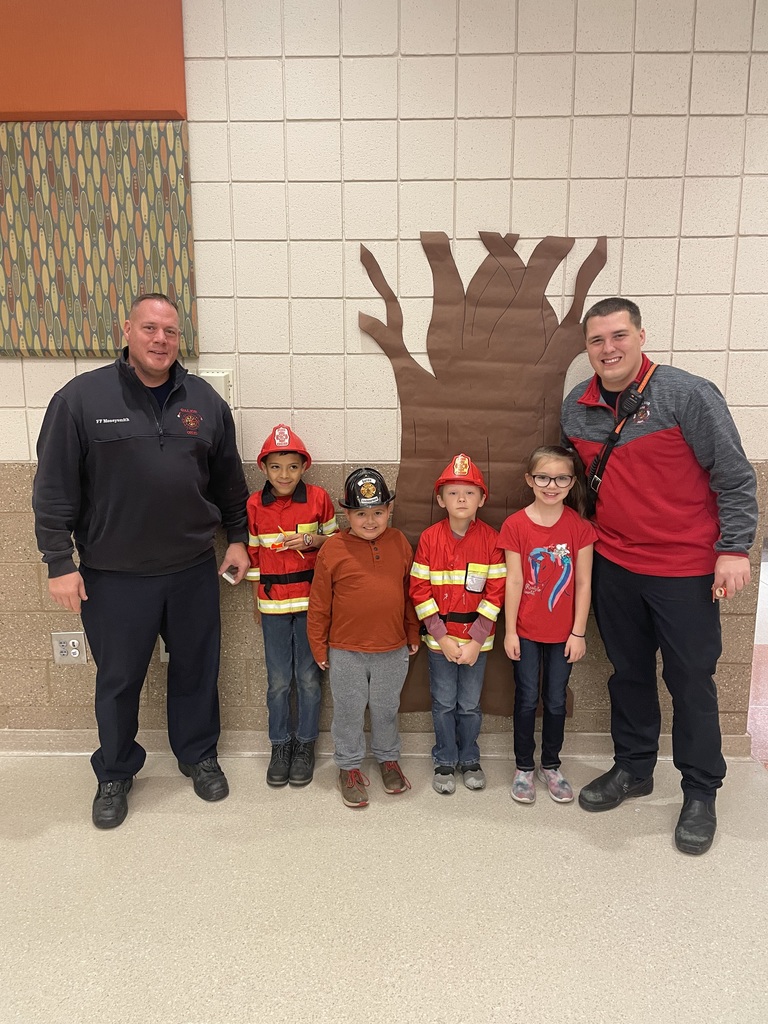 Students dressed as firefighters with Galion Firemen