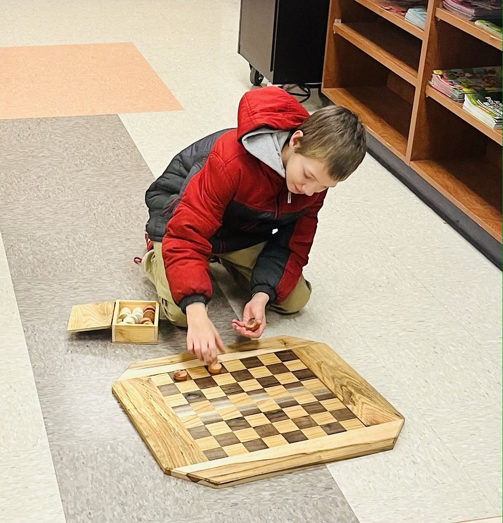 Students playing checkers