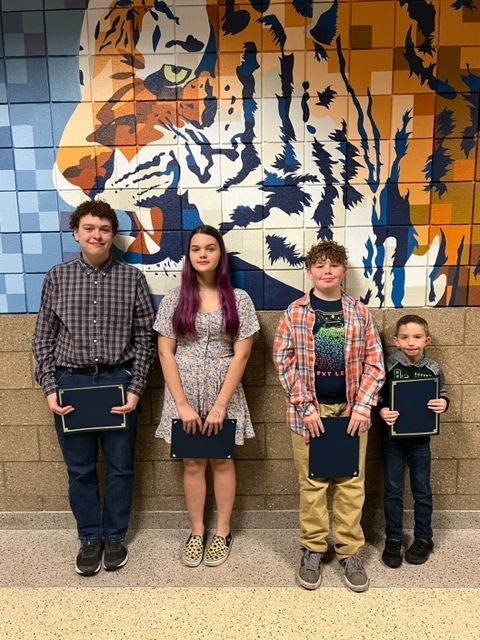 Students post for photo following board recognition