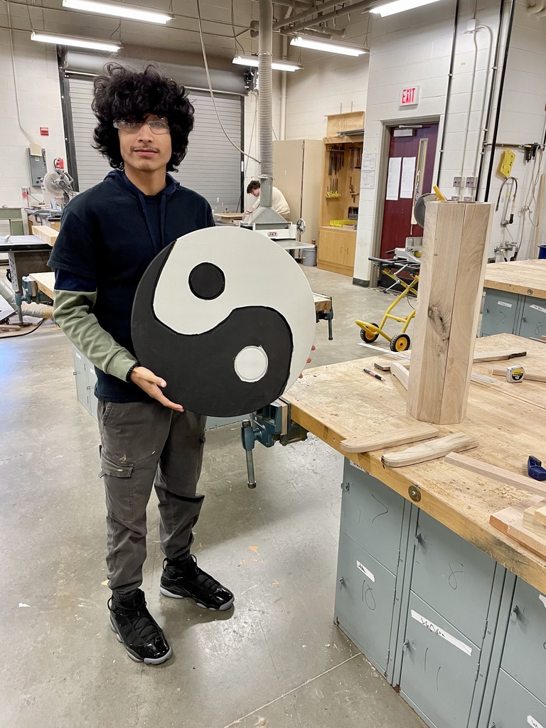 Carpentry student with project