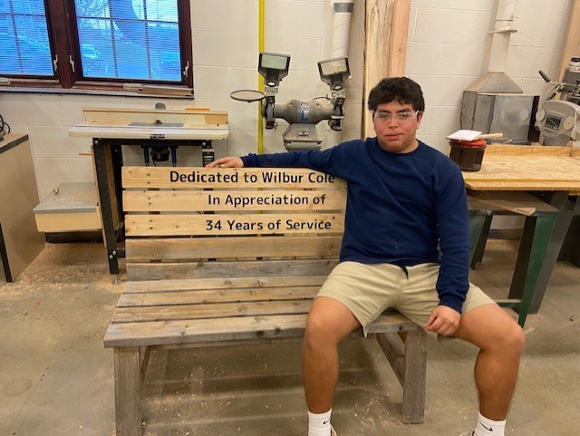 Carpentry student sitting on bench