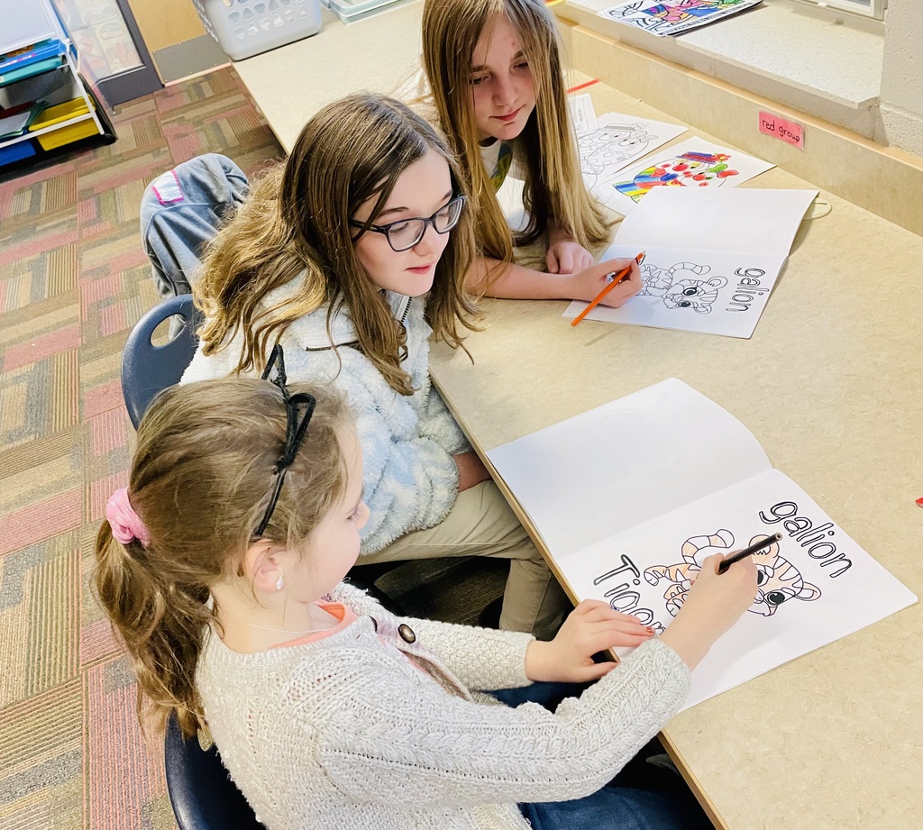 Students at table coloring together