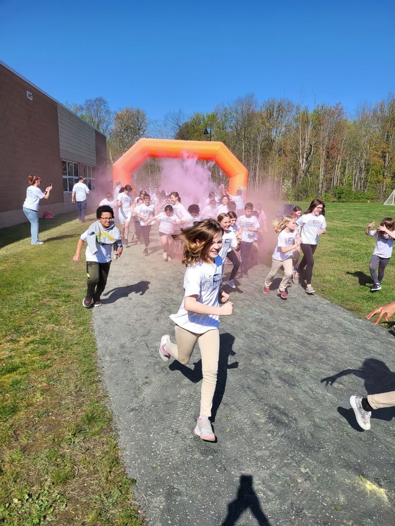 Students running through the color run