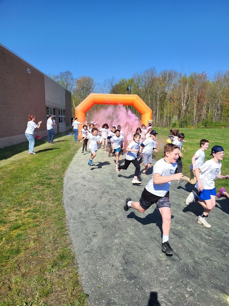 Students running through the color run