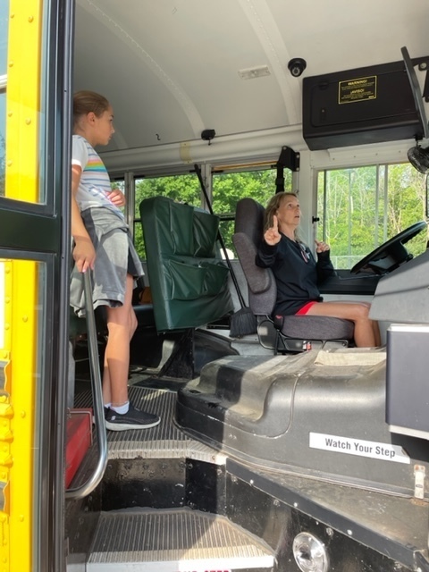 Bus driver teaching hand signals