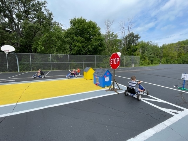 Students driving on safety town course